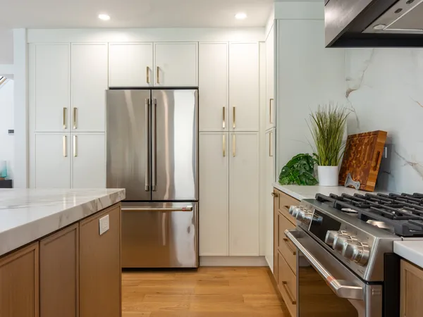 Margate Coastal Transformation — Custom kitchen with professional range